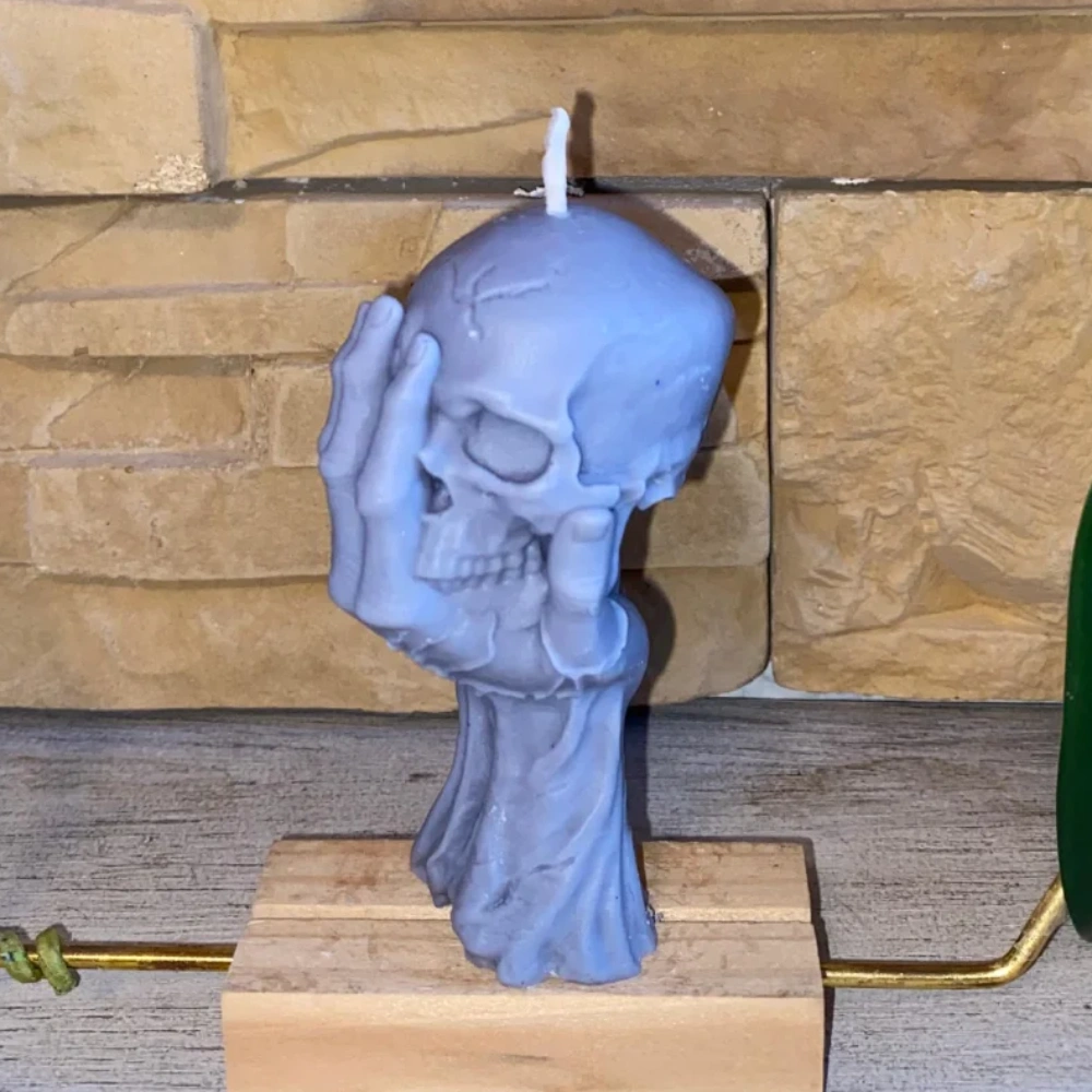 vela mano calavera